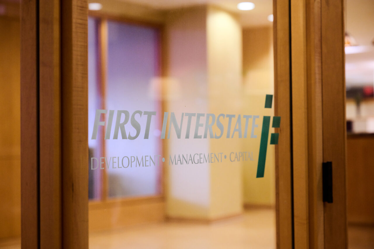 Photograph of a door at First Interstate Properties with logo